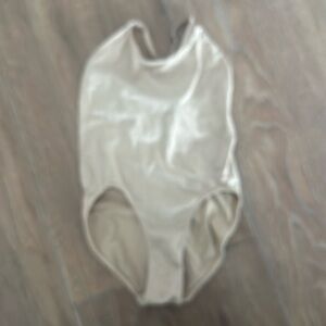 Girls beige leotard. Tag removed for comfort. See pictures for measurements.